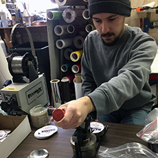 man making buttons